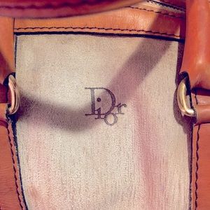 Christian Dior tan leather large duffel bag.